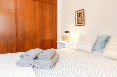 a room with a bed with towels on it at Secrets of Montserrat in El Bruc