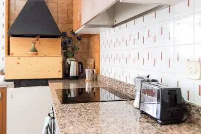 a kitchen with a counter top with a toaster and a toaster oven at Secrets of Montserrat in El Bruc