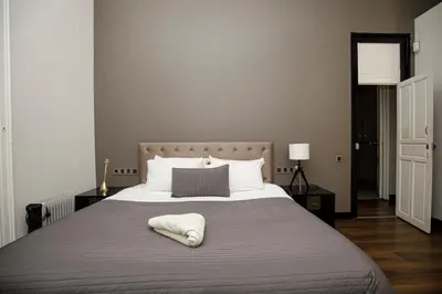 a bedroom with a bed with a white towel on it at Classic styled apartment in Barcelona