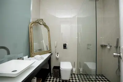 a bathroom with a sink and a toilet and a shower at Classic styled apartment in Barcelona