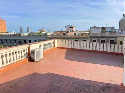 a balcony with a heater on top of a building at Barcelona Old Town attic near Catalunya square in Barcelona