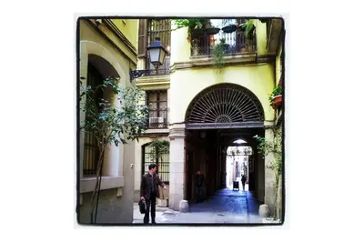 a man standing in front of a building at Barcelona Old Town attic near Catalunya square in Barcelona