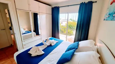 a bedroom with a bed with towels on it at Apartamento Cabrera Burriac in Cabrera de Mar