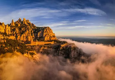 a view of a mountain above the clouds at Apartament Roca Foradada in Monistrol
