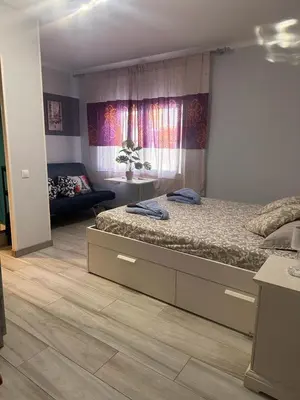 a bedroom with a bed and a couch in it at stop & go in Arbós