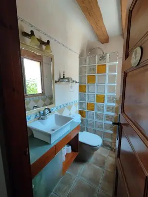a bathroom with a sink and a toilet at AMIRA home near Sitges in Sant Pere de Ribes