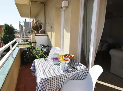 a table on a balcony with a drink on it at Can Josep in Vilassar de Mar