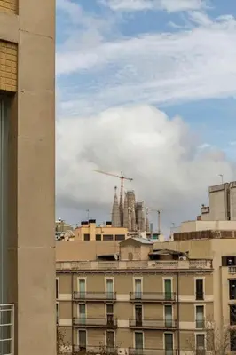 a view of a building with a city in the background at Canela Homes BARCELONA CÒRSEGA in Barcelona