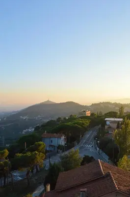 a street in a town with a hill in the distance at Circles House Coliving & Coworking in Barcelona