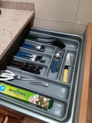a metal drawer filled with utensils in a kitchen at Casa Ferrer Barcelona in Hospitalet de Llobregat