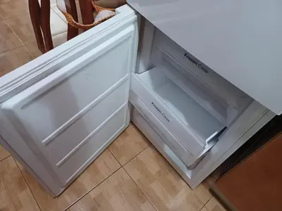a white refrigerator with its doors open in a kitchen at Casa Ferrer Barcelona in Hospitalet de Llobregat