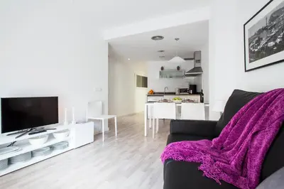 a living room with a couch and a table at Habitat Apartments Blanca in Barcelona
