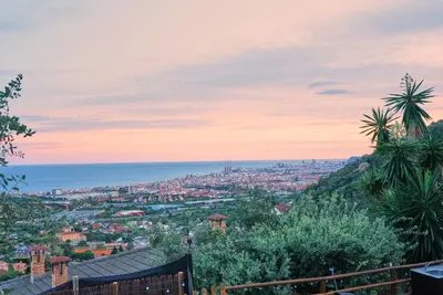 a view of a city from a hill at AAA View Private Terrace Outdoor Heated Hot Tub Family Fun in Badalona