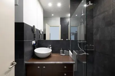 a bathroom with a sink and a mirror at Cute Apartment in Sants Station with HBO & Alexa & AC in Barcelona