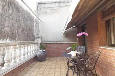 a patio with a table and two chairs and a table at Stay U-nique House Torre Damians in Barcelona