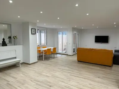 a living room with a couch and a table at APARTAMENTO EN LA PLAYA in Pineda de Mar