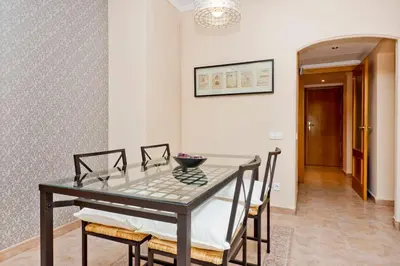 a dining room with a glass table and chairs at Glorias:Sagrada Familia 15 minutos - Playa 20 minutos in Barcelona