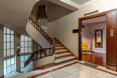 a spiral staircase in a house with a hallway at Canela Homes BARCELONA EIXAMPLE in Barcelona