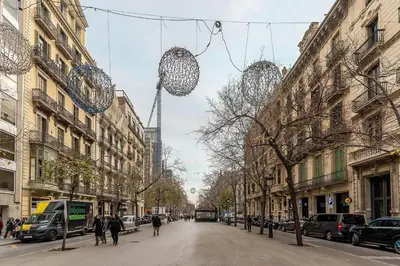 a street in a city with a tower in the background at Canela Homes BARCELONA RAMCAT37 in Barcelona