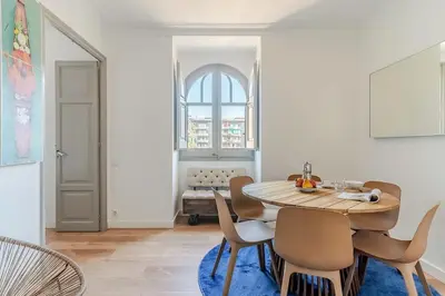 a dining room with a table and chairs at Canela Homes BARCELONA BAILÉN in Barcelona