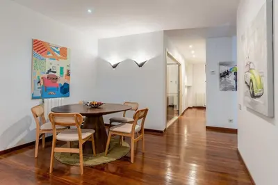 a dining room with a table and chairs at Canela Homes BARCELONA ARAGÓ in Barcelona