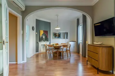 a kitchen and dining room with a table and chairs at Canela Homes BARCELONA ROSSELLÓ in Barcelona