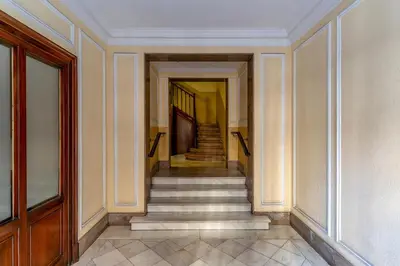 a hallway with stairs in a building at Canela Homes BARCELONA ROSSELLÓ in Barcelona