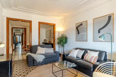 a living room with two couches and a table at Canela Homes BARCELONA VLC306 in Barcelona