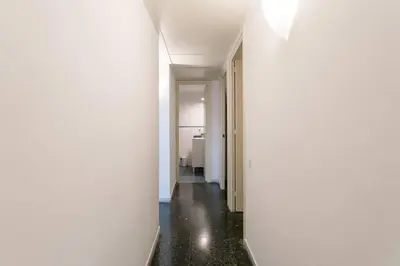 an empty hallway with white walls and a room at Canela Homes BARCELONA PARK GÜELL in Barcelona