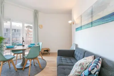 a living room with a couch and a table at Canela Homes BARCELONA COZY in Barcelona