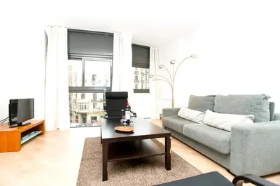 a living room with a couch and a coffee table at Apartment Bright Sagrada Familia in Barcelona