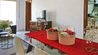 two baskets of flowers on a table in a living room at Auditori Barcelona in Barcelona