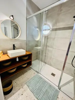 a bathroom with a shower and a sink at Villa Nova Vida Barcelona in Teià