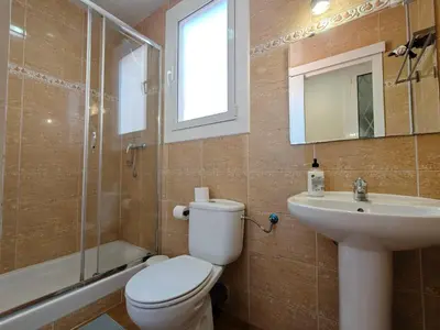 a bathroom with a toilet and a sink and a shower at Cozy apartment in Gracia in Barcelona