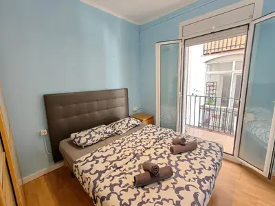 a bedroom with a bed with two teddy bears on it at Cozy apartment in Gracia in Barcelona