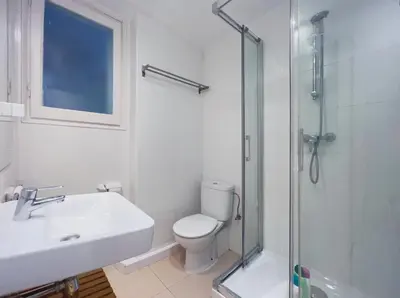 a bathroom with a toilet and a sink and a shower at Stay U-nique Apartments Gaudi I in Barcelona