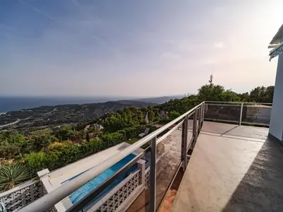 a balcony with a view of the ocean at Villa Elena in Pineda de Mar