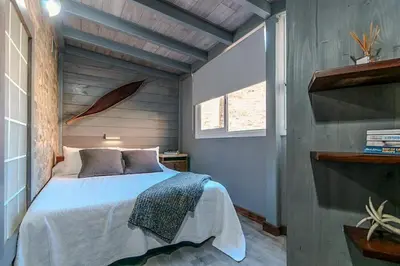 a bedroom with a bed in the corner of a room at Stay U-nique Apartment Tamarit II in Barcelona