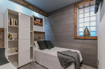 a bedroom with a bed and a window at Stay U-nique Apartment Tamarit II in Barcelona