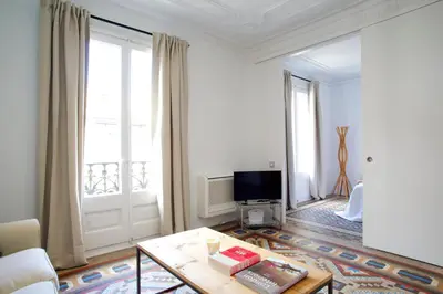 a living room with a coffee table and a television at BarcelonaForRent The Claris Suites I in Barcelona