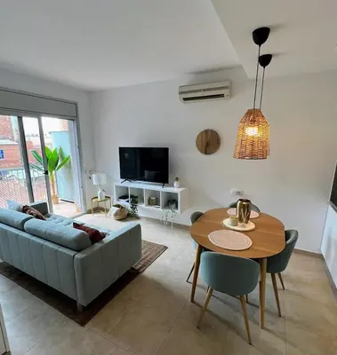 a living room with a couch and a table at Loft acogedor cerca de Barcelona in Terrassa