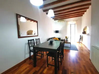 a dining room with a black table and chairs at VL51 in Barcelona