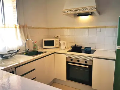 a small kitchen with a sink and a microwave at VL51 in Barcelona