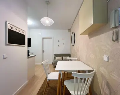a living room with a white table and chairs at Stay U-nique Apartments Rambla Catalunya V in Barcelona
