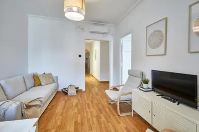 a living room with a couch and a flat screen tv at BBarcelona Central Eixample Flat in Barcelona
