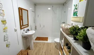 a bathroom with a sink and a toilet at Casa de invitados in La Torre de Claramunt