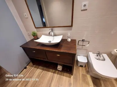 a bathroom with a sink and a toilet at Cerca de Barcelona, y entre tres Parques Naturales, casa de 4 habitaciones y 2 baños con piscina, barbacoa y chimenea in San Antonio de Vilamajor