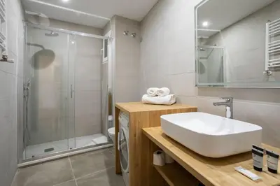 a bathroom with a sink and a shower at Canela Homes BARCELONA PADILLA in Barcelona