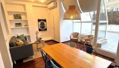 a living room with a table and a dining room at FANTASTIC apartment in Barcelona in Barcelona