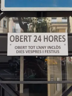 a sign on the window of a store at Alberg Sants Bcn in Barcelona